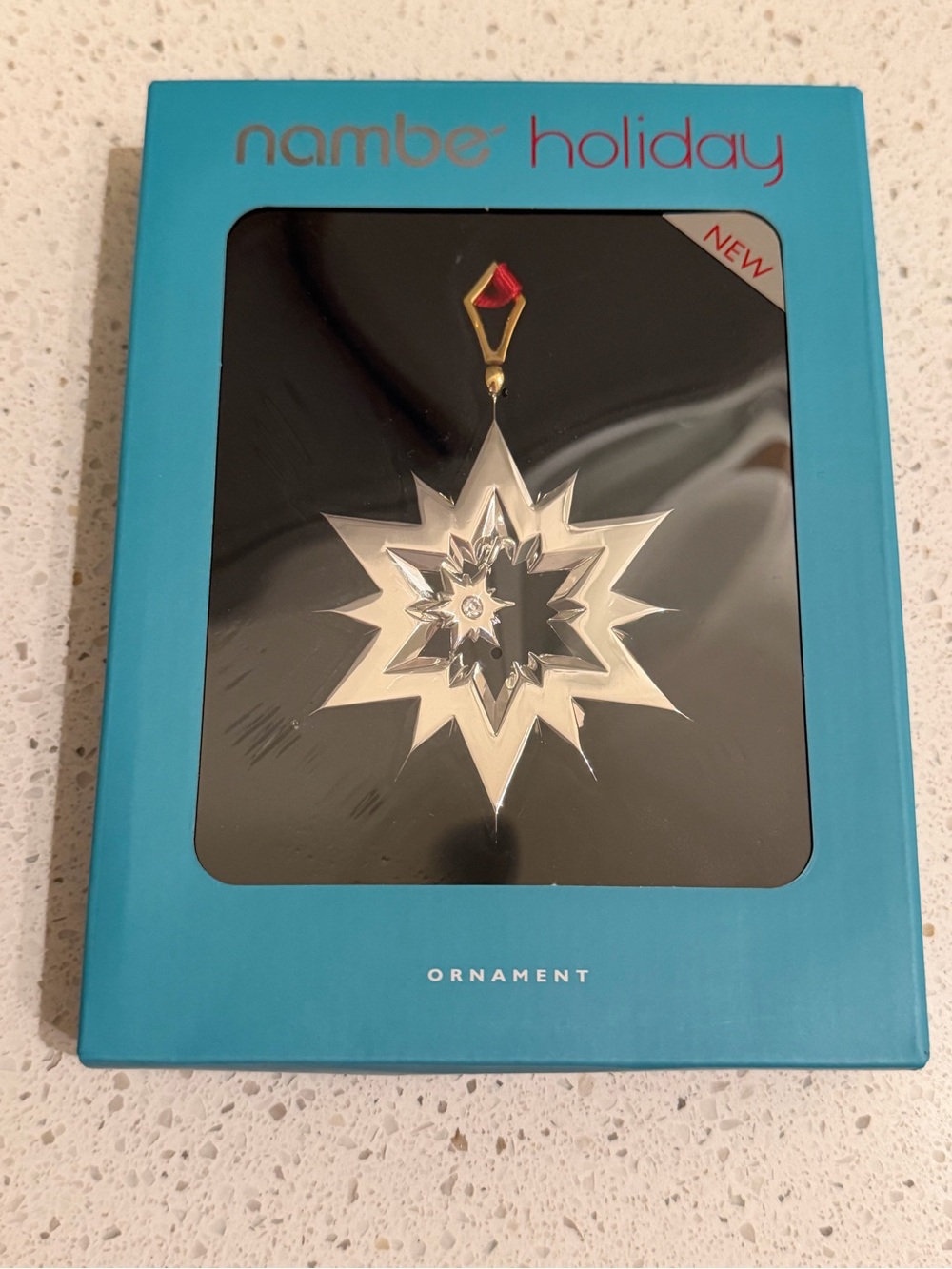 Nambe Silver Starburst Ornament with Gold and Red Accent